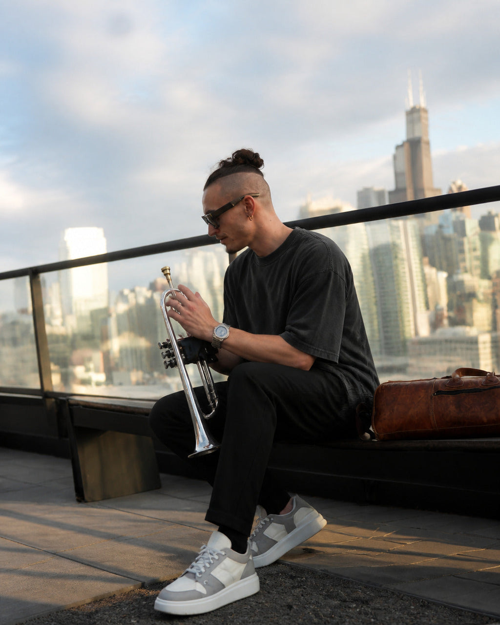 Founder wearing The Blueprint Tee front view on a Chicago rooftop