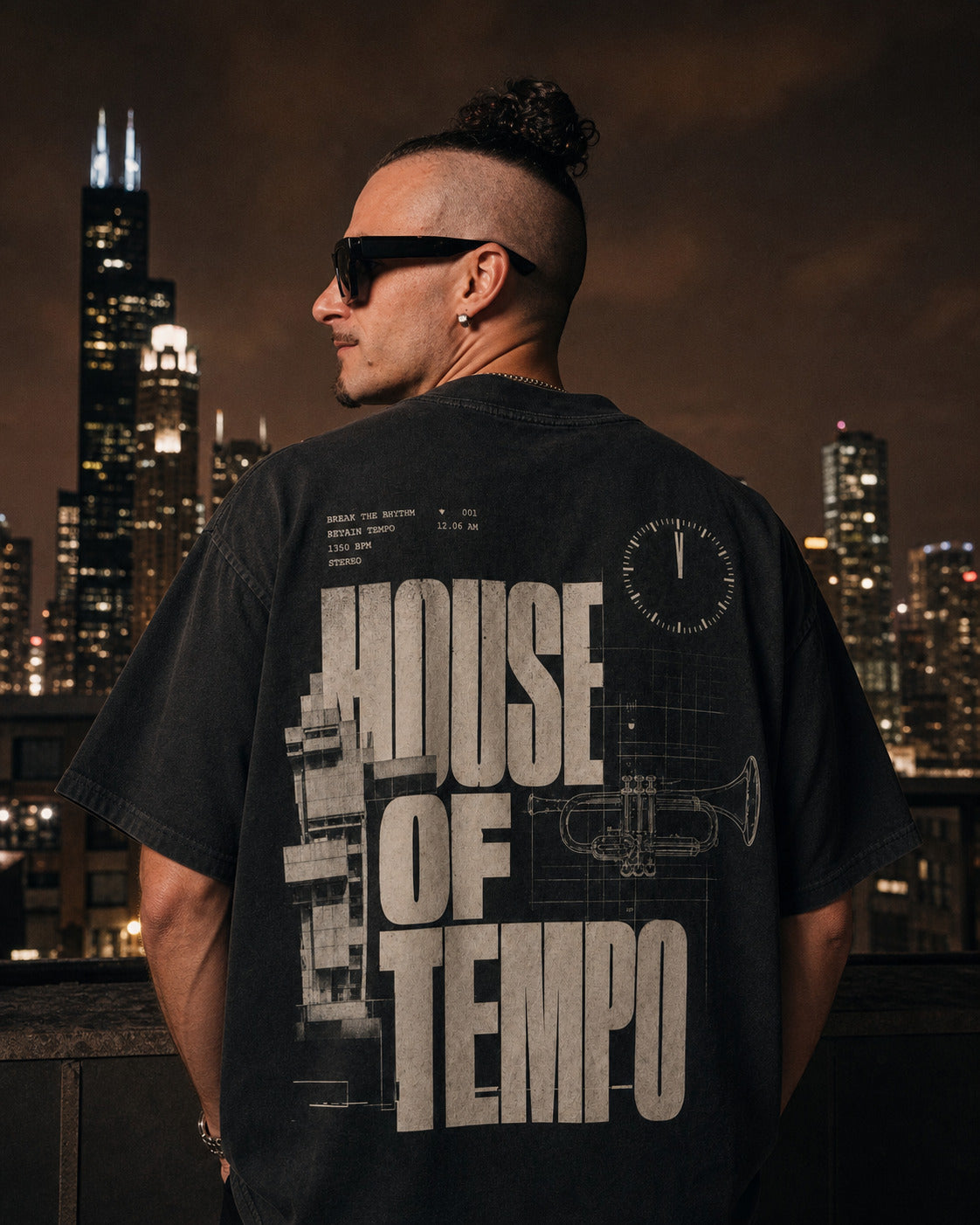 Founder wearing The Blueprint Tee back view on a Chicago rooftop