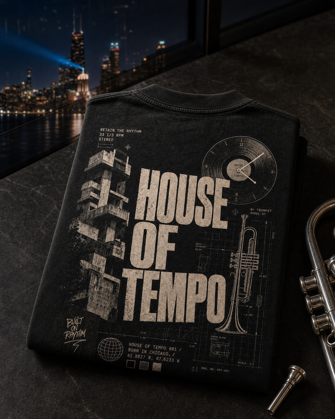 The Blueprint Tee with trumpet and Chicago skyline still life
